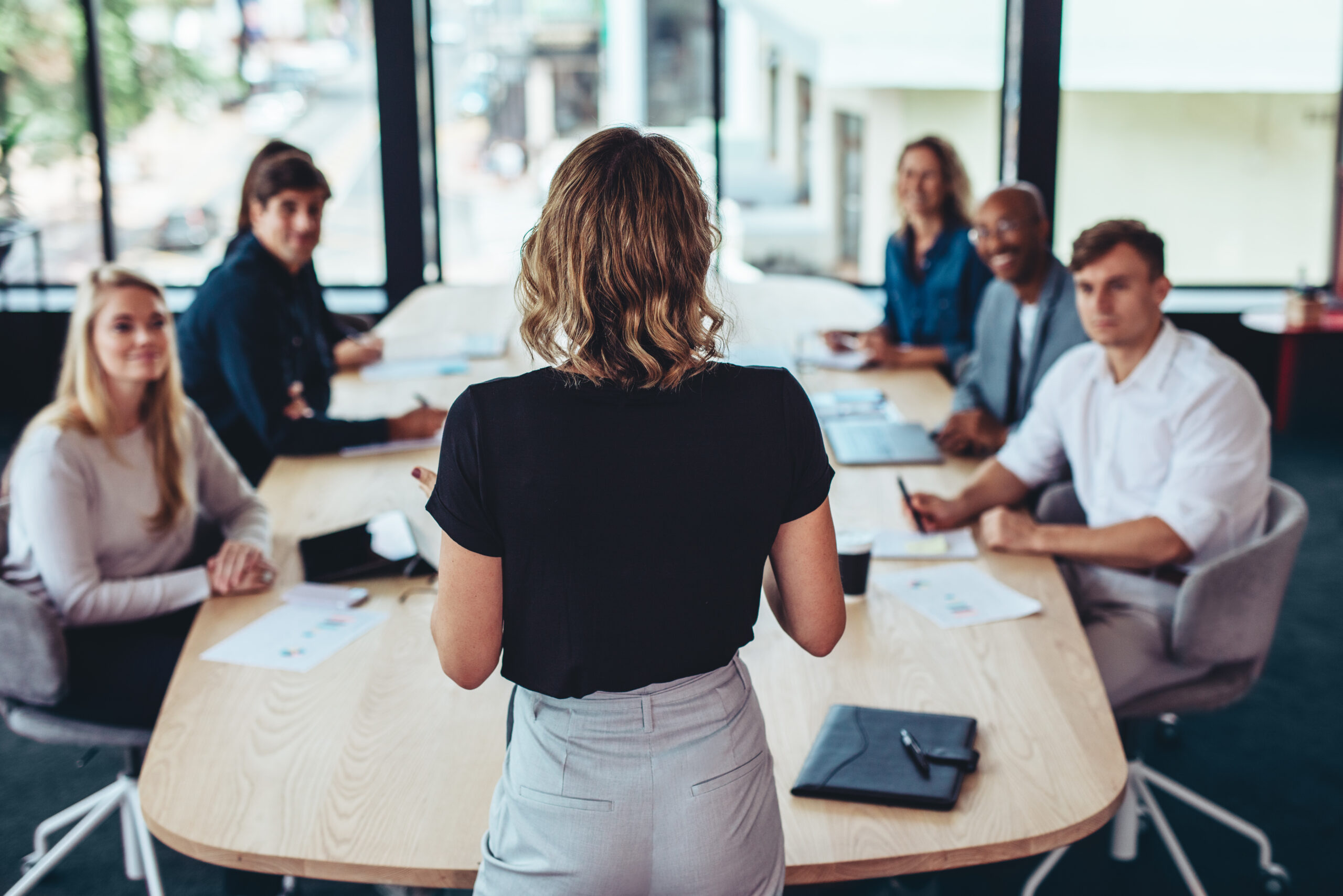 Woman leading a meeting with a marketing team